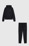 Detalle del pantalón negro Champion 222696 con bolsillo lateral y logo Champion