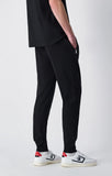 Pantalón hombre Champion SLIM puño y cremallera bolsillos 220807 negro - Puber Sports